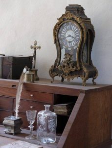 MG Moving Services Antique and Collectible Moving antique clock and other items on desk